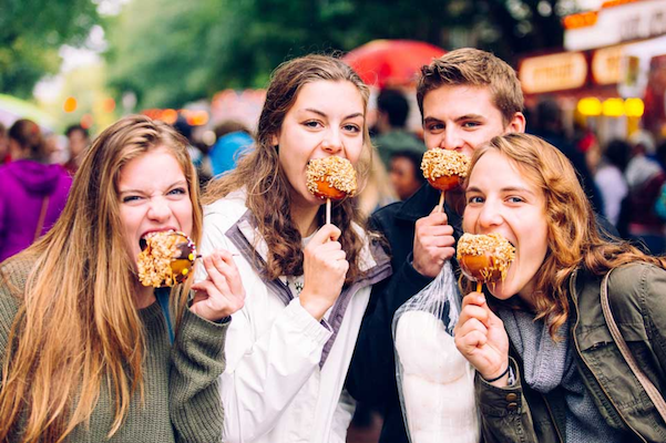 Four young visitors enjoying their candy apples!
